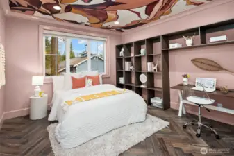 The third bedroom is thoughtfully designed, featuring custom shelves that provide practical storage solutions while enhancing the room's aesthetic. This bedroom also includes a private en-suite bathroom, offering convenience and privacy.