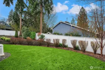 9957 sq ft lot with great landscaping (including generator).  Picture has been enhanced with blue sky and green grass.