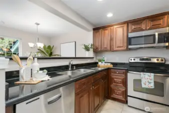 Quartz countertops and Stainless Steel appliances.