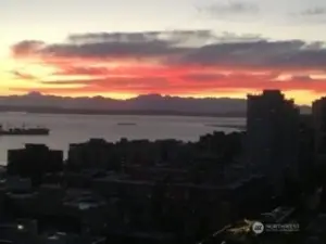 Gorgeous outline of the Olympics, brilliant sky and a freighter floating by.