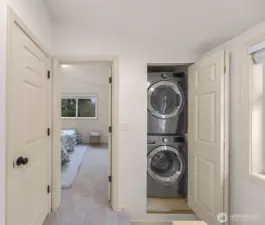 Convenient laundry room on floor with primary bedroom!