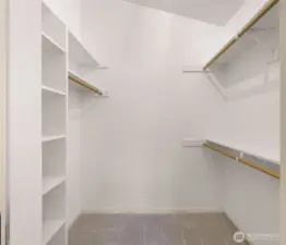 Primary bedroom walk in closet.