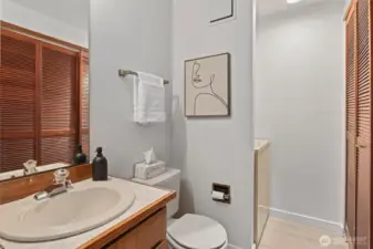 Main level powder room and laundry.