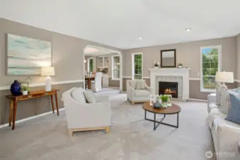 Gorgeous, spacious living room complete with a cozy gas fireplace.