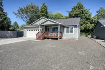 Low maintenance front of home provides plenty of parking space, with room for an RV if desired.