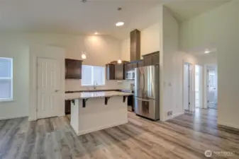 Off the kitchen, you will find the main bath and two bedrooms.
