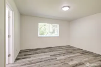 Primary suite overlooks the peaceful back yard.