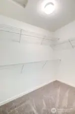 Walk in closet in the primary suite.