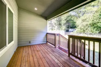 Off the dining room is the covered rear deck.