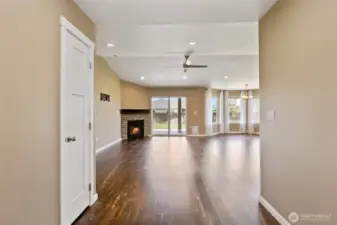 View of the great room, with gas fireplace and sliding glass door to backyard