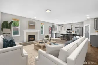 Spacious living area featuring gas fireplace, open layout, and eat-in kitchen (virtually staged)