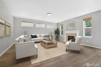 View of living room from the kitchen (virtually staged)