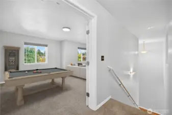Spacious second-level multipurpose bonus room, virtually staged as a combination media/TV room and game/play area, easily functions as separate areas (virtually staged)
