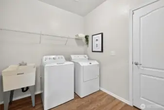 Main floor laundry room conveniently located with direct access to the garage