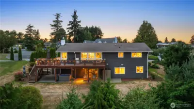 Big deck, covered patio area, hot tub, & more!