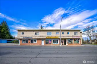 Dynamic mixed-use asset in Everett’s revitalizing urban core. Interurban Crossing spans a 26,572 SF corner lot with alley access, 20+ parking spaces, and a 7,629 SF structure leased to stable local tenants—3 storefronts, 3 apartments, and 3 flex spaces. Current gross rent over $64K; pro forma $144K+ with light upgrades. Just 26.3% lot coverage—NB zoning + Opportunity Zone offer phased development potential. Steps from the Interurban Trail, future light rail, and new stadium district. A walkable, well-connected location with built-in income and big upside....