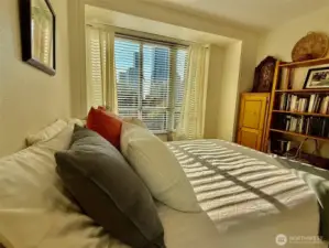Second bedroom has a serene feel, whether filtered with the blinds lowered or bathed in sunlight.  Your choice!