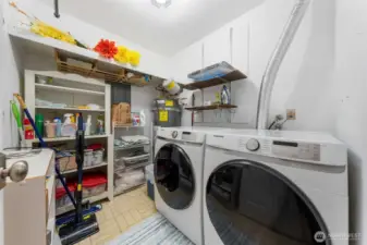 Washer/dryer in unit with spacious laundry room.