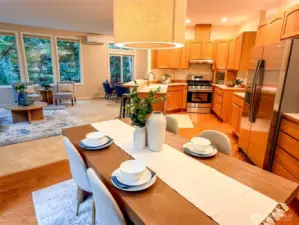 looking from the dining into the living area and kitchen.