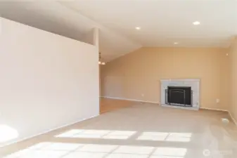 Wide open to dining room and kitchen on the other side.