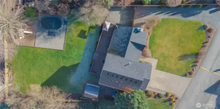 Huge lot with well-manicured landscaping and tons of parking and space to play.