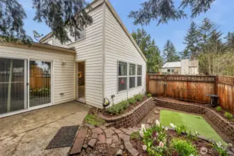 Fenced yard with landscaped courtyard