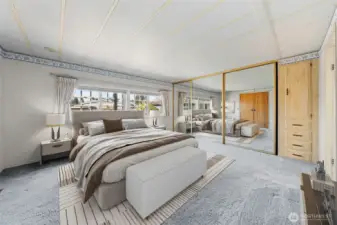 Digitally staged primary bedroom.