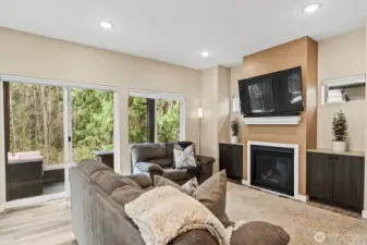 Spacious living room with gas fireplace.