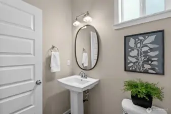 A powder room on the main is conveniently located between the dining room and the kitchen.