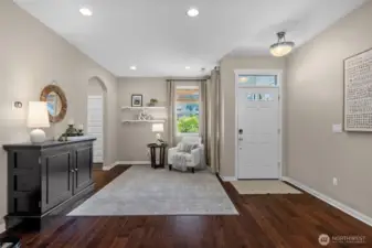 Beautiful engineered hardwood flooring flows throughout the main level, paired with soft, light tones for a warm and welcoming feel.