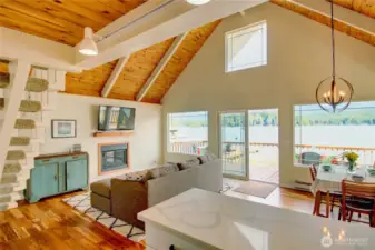 Living and dining open to lakeside deck.