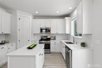 Functional Kitchen with Solid Stone Counters & Stainless Steel Appliances