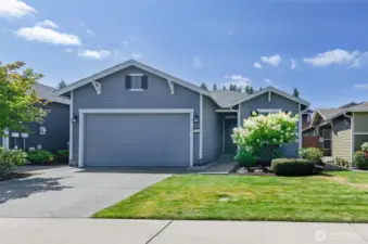 8235 Ridgefield Av NE.  This immaculately kept Pebble Beach floor plan built by Shea has so much to offer.