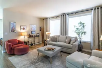 Main living area is centrally located and has large windows that allows for the flow of natural light.