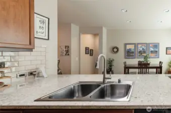Beautiful quartz countertops.  New sink and faucet.