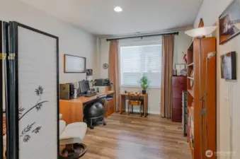 Open den makes a nice work area or craft room.