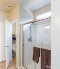 Expanded shower and private toilet area.