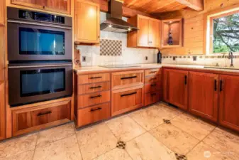 Kitchen has double oven. Entire kitchen designed and built on premise by Treehouse remodeling with select woods  chosen for this house.