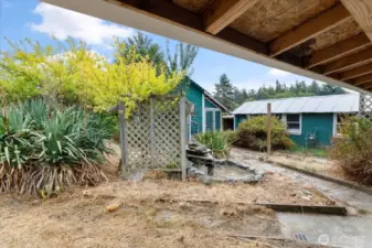 Bring your gardening gloves! Previously, garden was bursting with beautiful greenery, and lovely fountain. Many of the plants are dormant until spring. Restore it and enjoy your own private oasis.