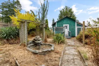 Bring your gardening gloves! Previously, garden was bursting with beautiful greenery, and lovely fountain. Many of the plants are dormant until spring. Restore it and enjoy your own private oasis.