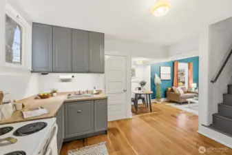 Through the door straight ahead is access to the backyard & storage space