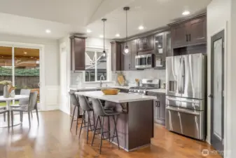 View of Kitchen with breakfast nook and entry to backyard patio