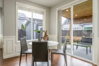 Breakfast nook and view of covered patio and yard