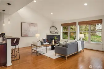 The living room features a vaulted ceiling with a clerestory window up above on the left.