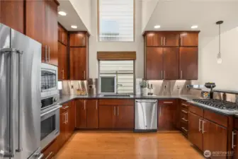A wonderfully laid out kitchen with an oversized 6 burner Viking range on the right.