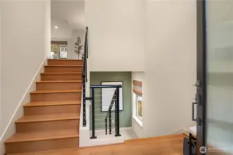 The cable railing provides a nice contrast to the wood flooring.