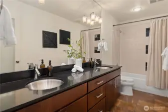 This is the main bath for the bedroom level which also features dual undermount sinks and heated floors.