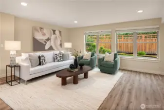 This pool sized rec room does not have a "basement-y" feel at all with plenty of windows and access to the backyard.