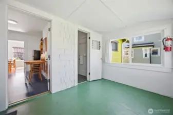 Another view of the utility room with access to the kitchen and full bath.