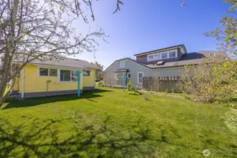 The rear yard is level and spacious and there is a clothes line.